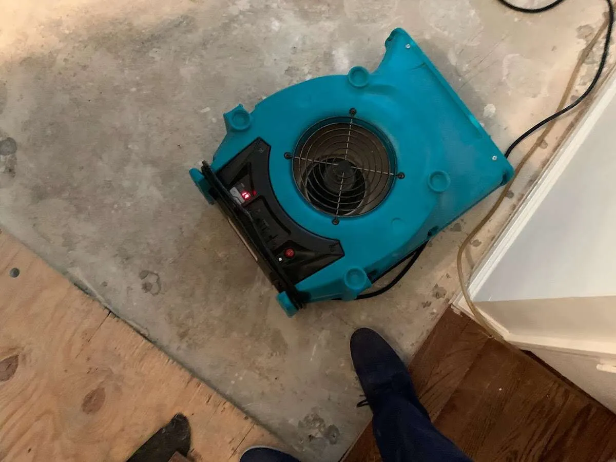 Air mover drying subfloor during Commercial Water Damage Restoration in Chanceford